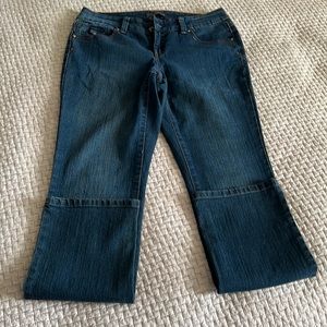 Women’s Covington denim size 4P. Darker blue.